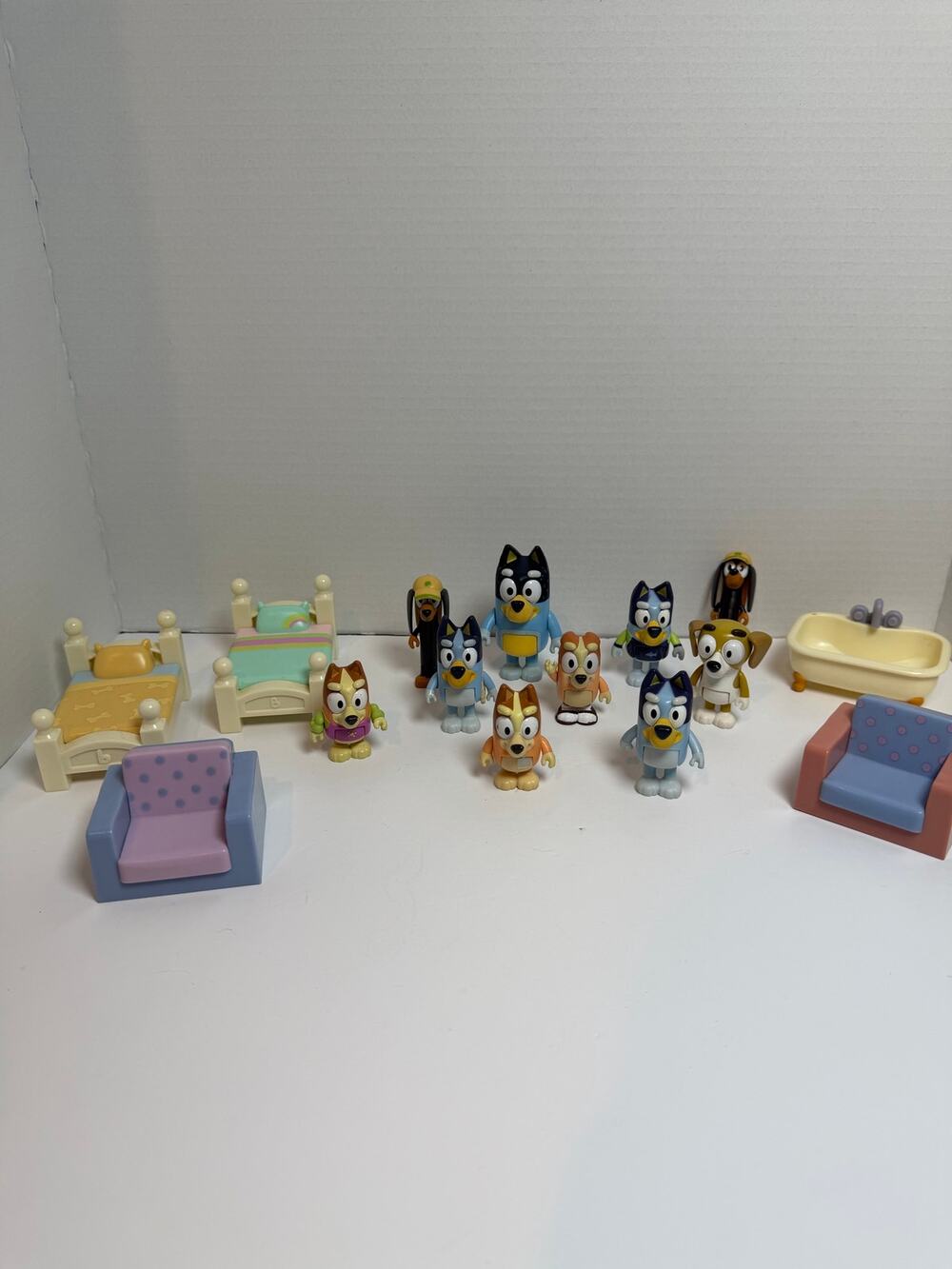 Lot of 10 Bluey figures, along with furniture